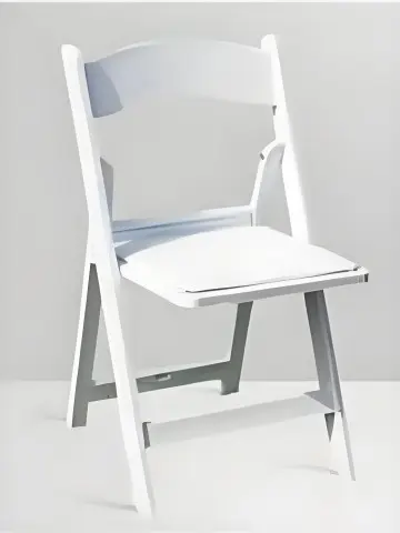 The white folding chair is ...